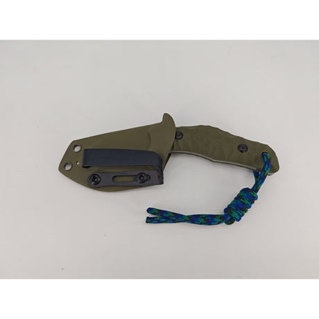 T Rex Kralle mit olivgrünem G10-Griff und Kydex-Scheide von oben fotografiert